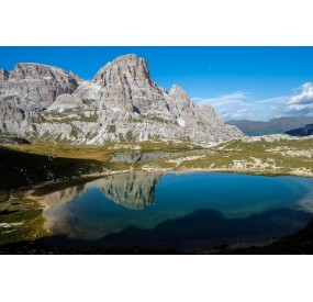 Amazing reflection on the calm water of Laghi dei Piani, behind rifugio Locatelli